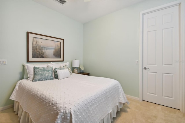 bedroom featuring light colored carpet