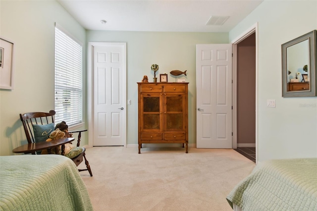 bedroom featuring light colored carpet