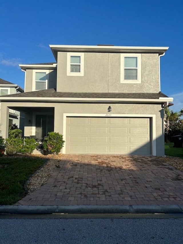 view of front of property with a garage