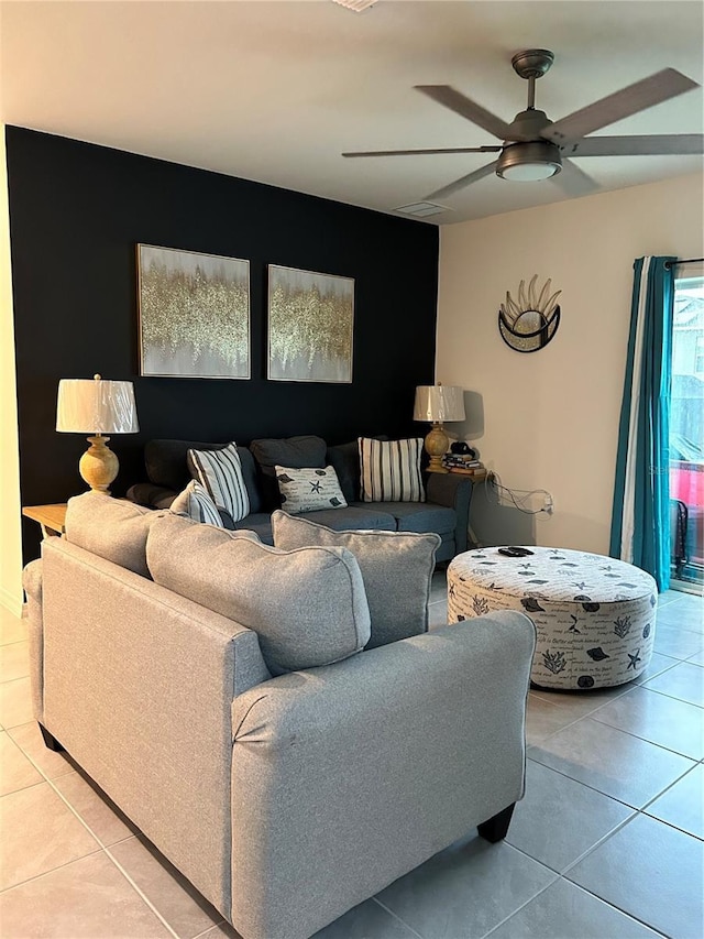 tiled living room featuring ceiling fan