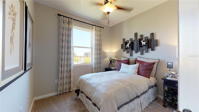 bedroom featuring ceiling fan and light carpet