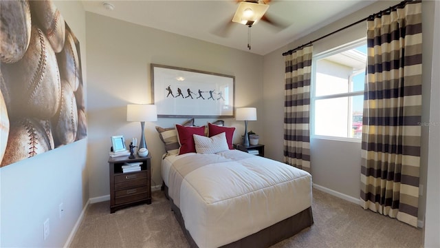 bedroom with ceiling fan and light carpet