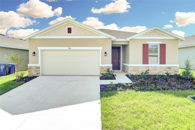 view of front of property featuring a garage and a front lawn