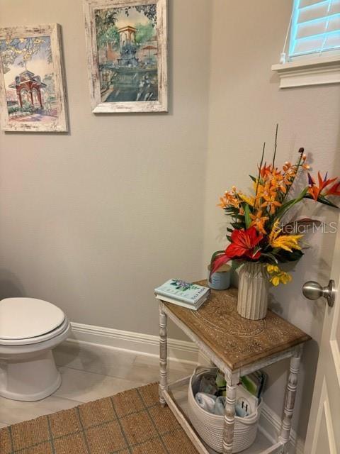 bathroom featuring tile patterned floors and toilet