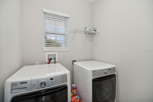 washroom featuring washer and dryer