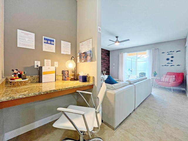 tiled living room with ceiling fan