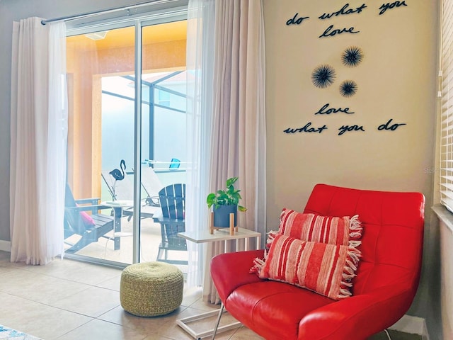 living area with tile patterned floors