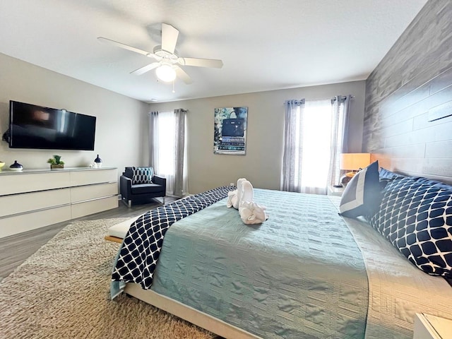 bedroom featuring ceiling fan and wood-type flooring