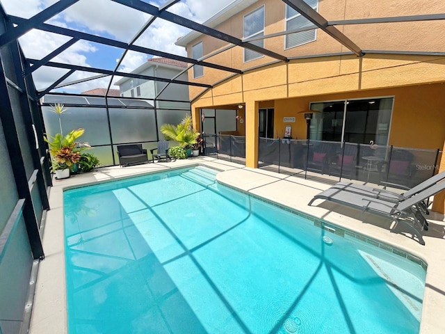 view of pool featuring a patio and a lanai