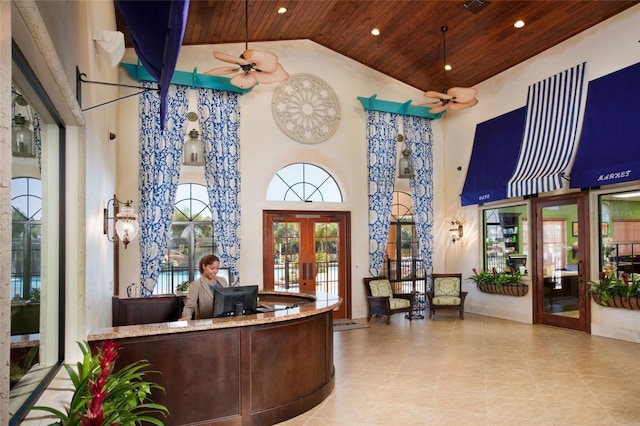 reception area with ceiling fan and french doors