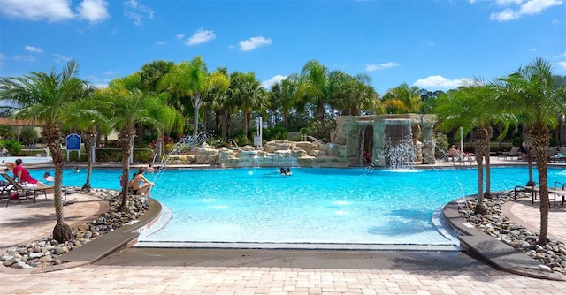 view of pool with pool water feature and a patio area