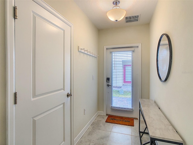 doorway featuring light tile flooring