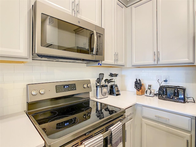 kitchen featuring appliances with stainless steel finishes and backsplash