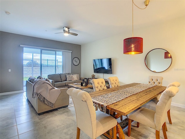 dining area featuring tile flooring and ceiling fan