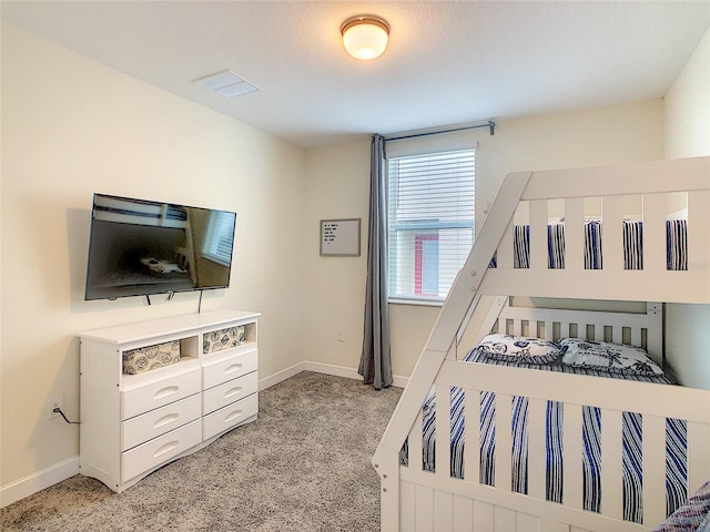 bedroom featuring light colored carpet