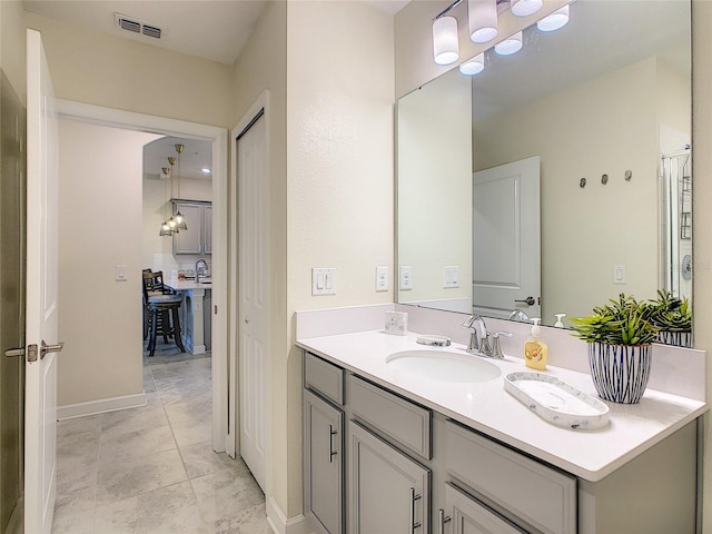 bathroom with tile flooring and vanity