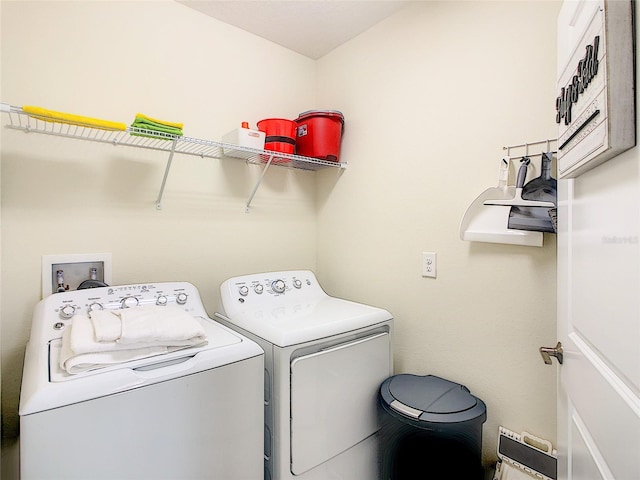 washroom featuring hookup for a washing machine and washing machine and clothes dryer