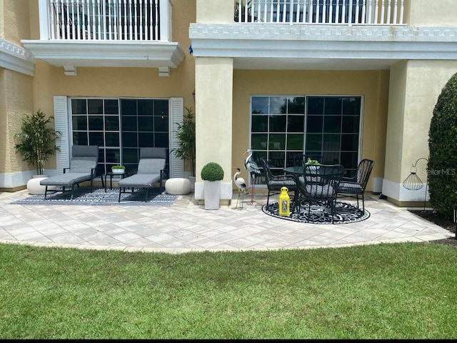 view of patio / terrace with a balcony