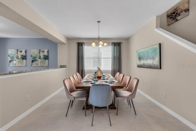 dining area with an inviting chandelier and light tile patterned floors