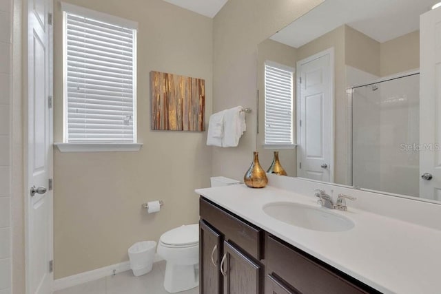 bathroom with tile patterned floors, toilet, walk in shower, and vanity