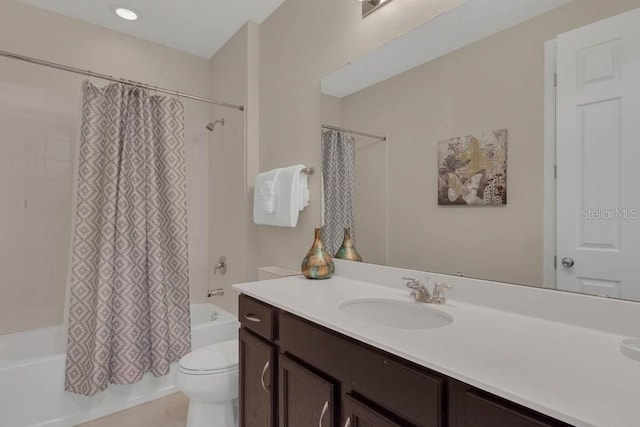 full bathroom featuring vanity, toilet, and shower / tub combo with curtain