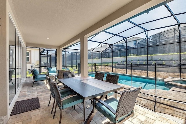 exterior space featuring a lanai, a pool with hot tub, and an outdoor living space