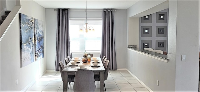 dining space featuring a notable chandelier and light tile patterned floors