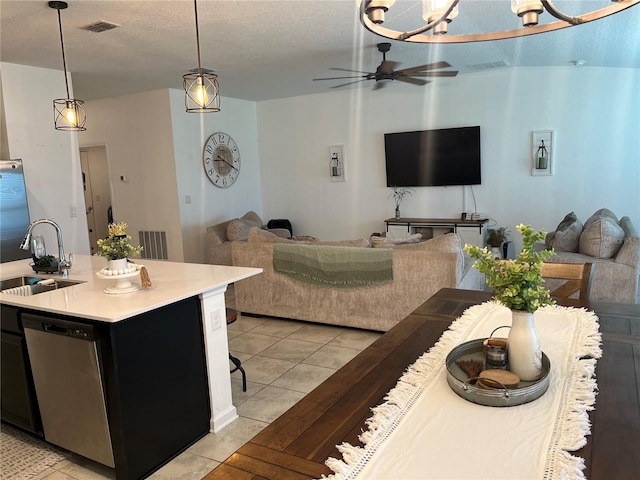 living room featuring sink, ceiling fan, and light tile floors