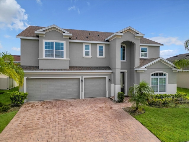 view of front of property with a garage