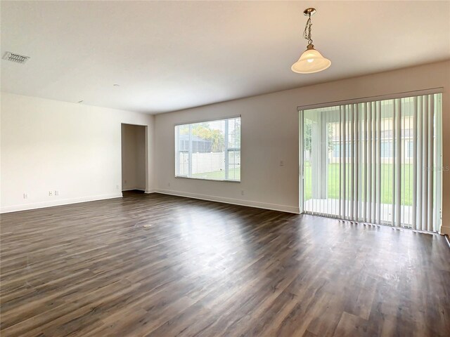 empty room with dark wood-type flooring