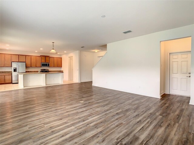 unfurnished living room with light wood-type flooring