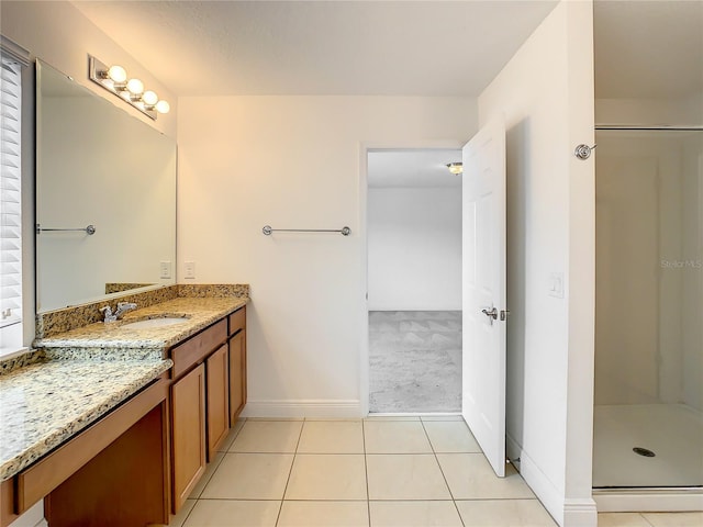 bathroom featuring walk in shower, tile flooring, and vanity