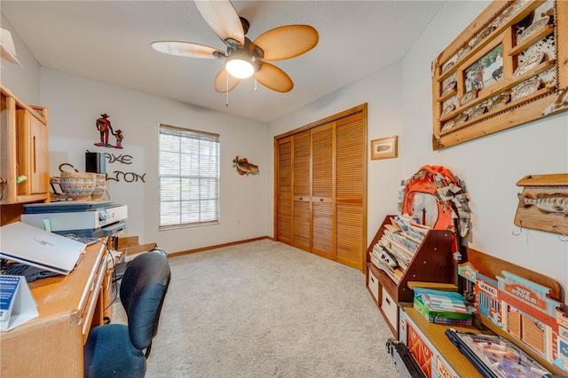 office area with ceiling fan and carpet floors