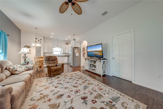 living room with ceiling fan, arched walkways, recessed lighting, visible vents, and dark wood-style floors