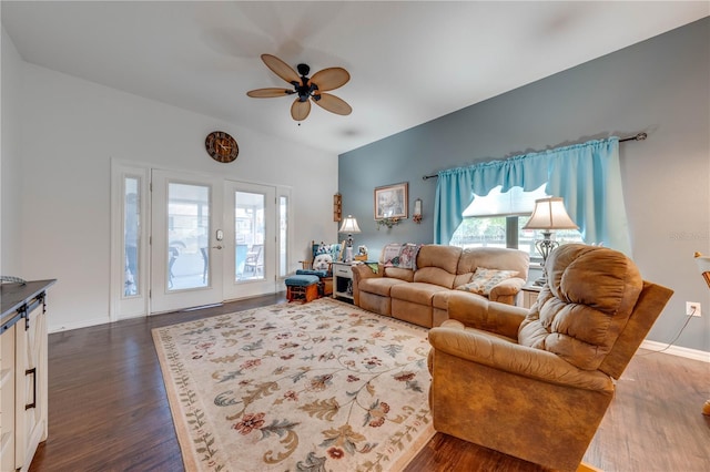 living room with french doors, dark wood finished floors, baseboards, and ceiling fan