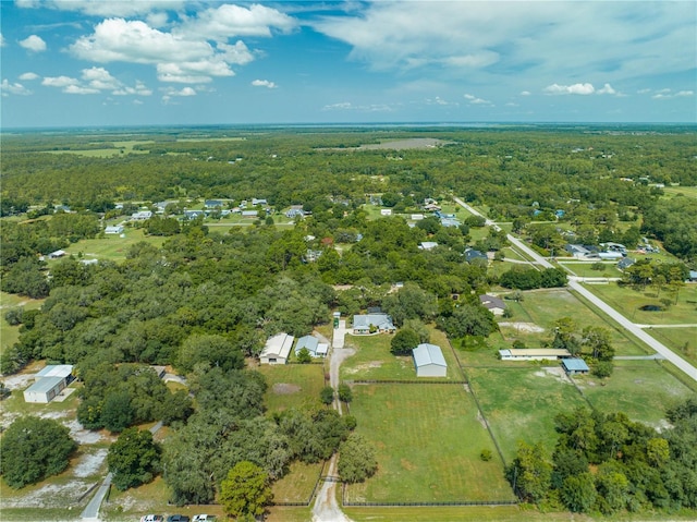 drone / aerial view featuring a view of trees