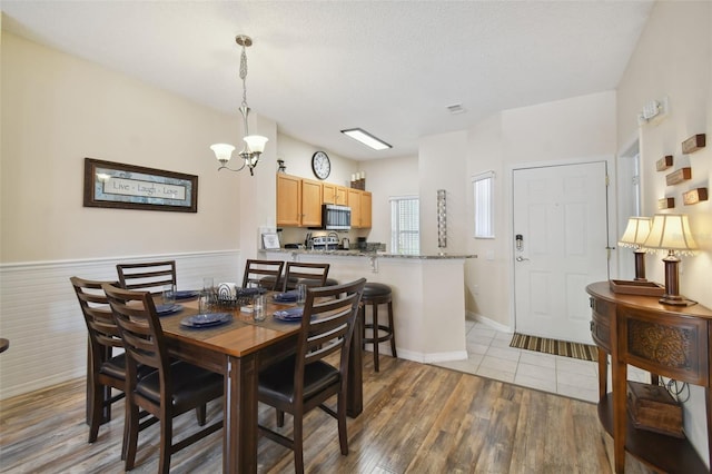 dining space featuring a chandelier and hardwood / wood-style floors