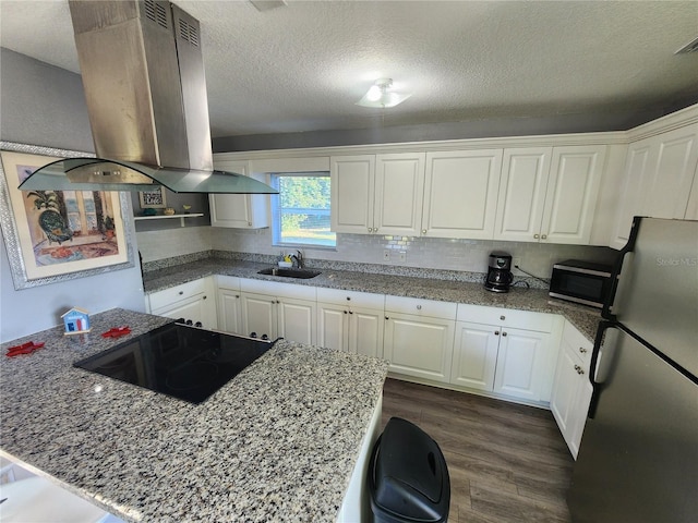 kitchen featuring white cabinets, dark hardwood / wood-style flooring, stainless steel appliances, island exhaust hood, and sink