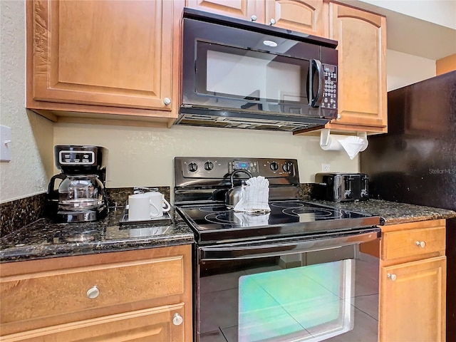 kitchen with dark stone countertops and range with electric stovetop