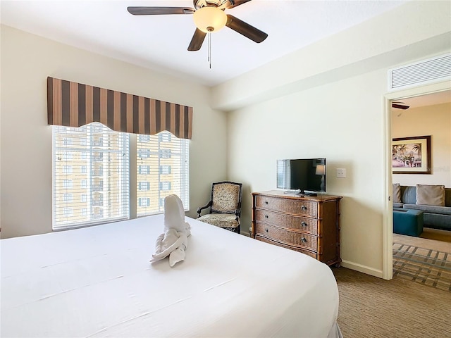 carpeted bedroom with ceiling fan