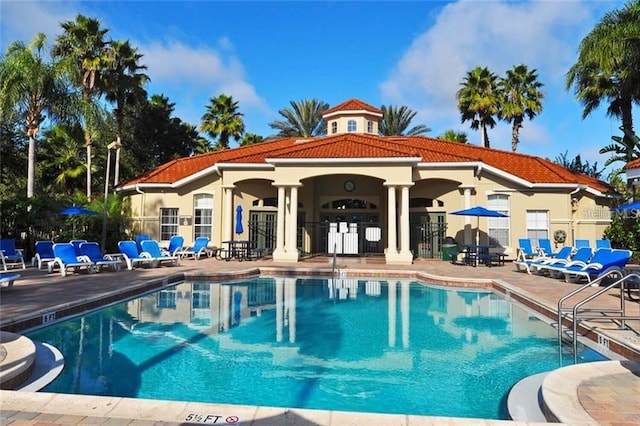 view of swimming pool featuring a patio area