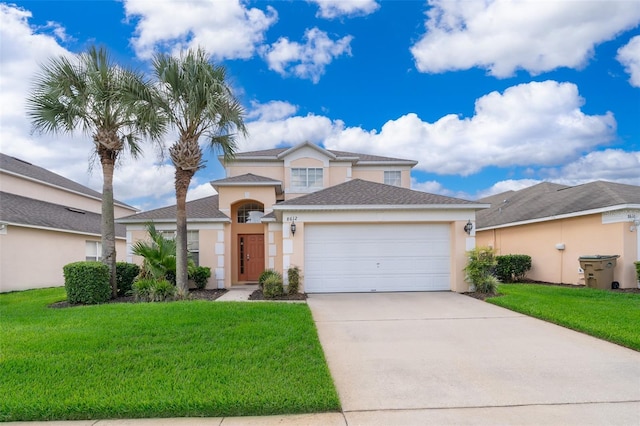 view of front of property featuring a front yard and a garage