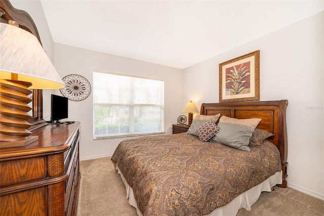 bedroom featuring light colored carpet