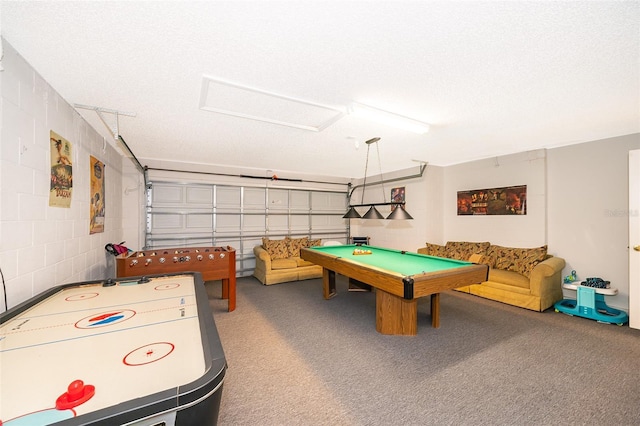 recreation room with a textured ceiling and billiards