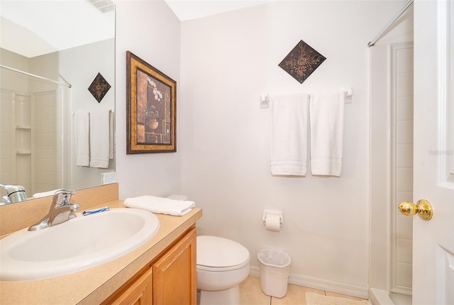 bathroom with toilet, vanity, tile patterned floors, and walk in shower