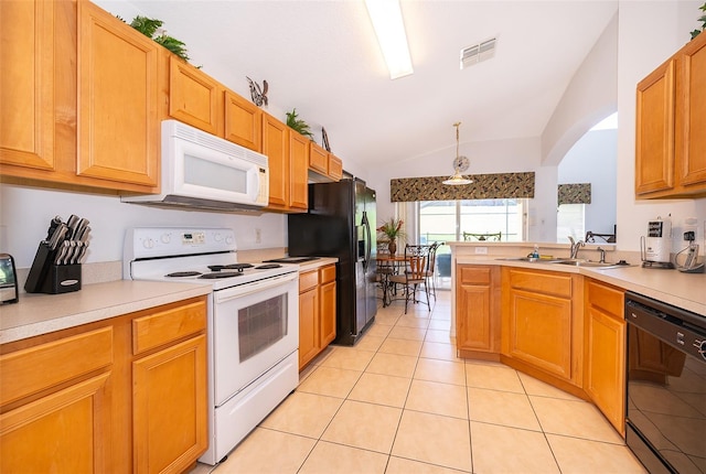 kitchen with lofted ceiling, black appliances, sink, decorative light fixtures, and light tile patterned flooring