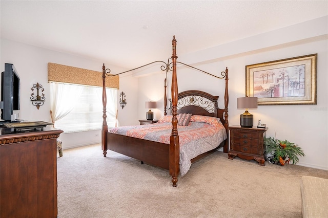 bedroom featuring light colored carpet