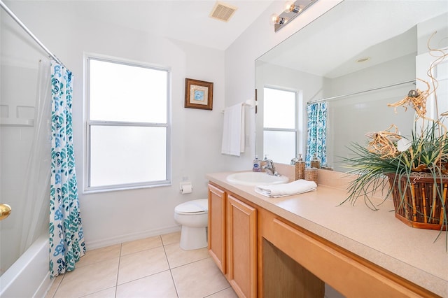 full bathroom with tile patterned flooring, vanity, shower / tub combo, and toilet