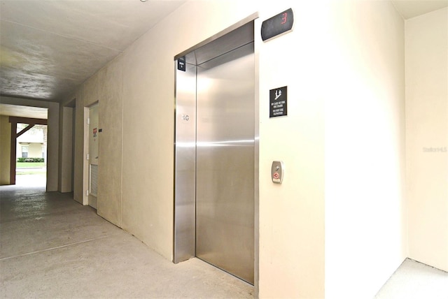 hallway featuring elevator