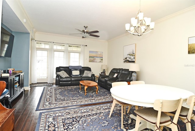 dining area with ceiling fan with notable chandelier, crown molding, and dark wood-type flooring